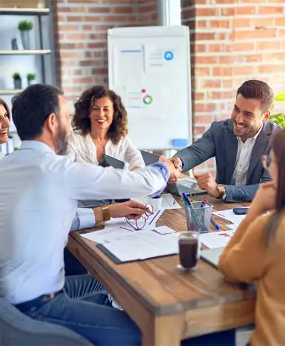 Business meeting with handshake agreement.